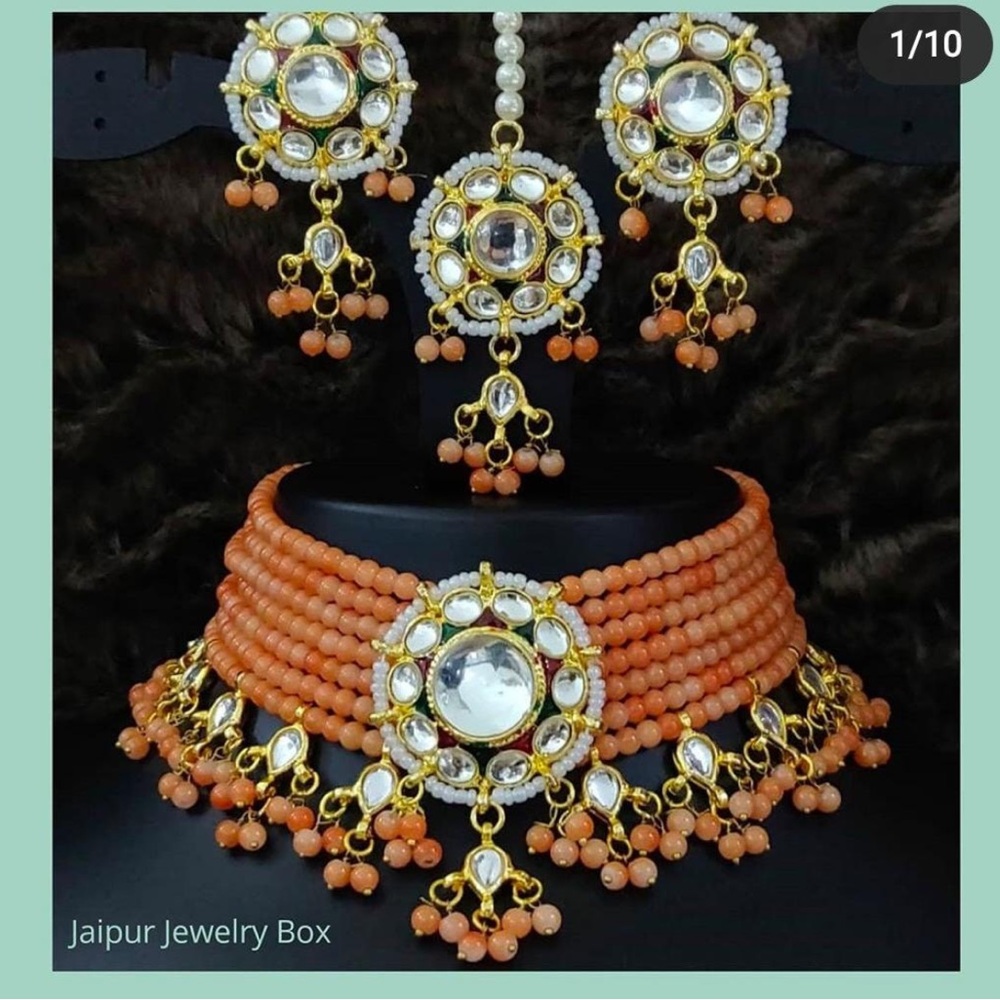 Light orange indian stone necklace earring and tika set